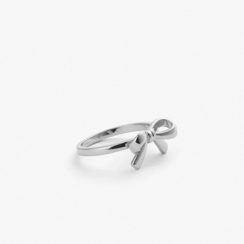 sterling silver bow ring on white background