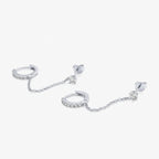 Silver dual chain hoop earrings laid flat