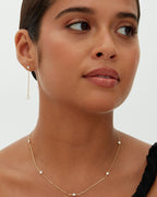 Minimalist gold necklace with evenly spaced cubic zirconia stones