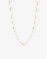 Gold cubic zirconia chain necklace worn on model – delicate minimalist design