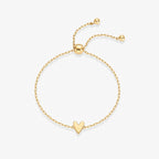 Minimal gold hollow heart bracelet with an adjustable slider clasp