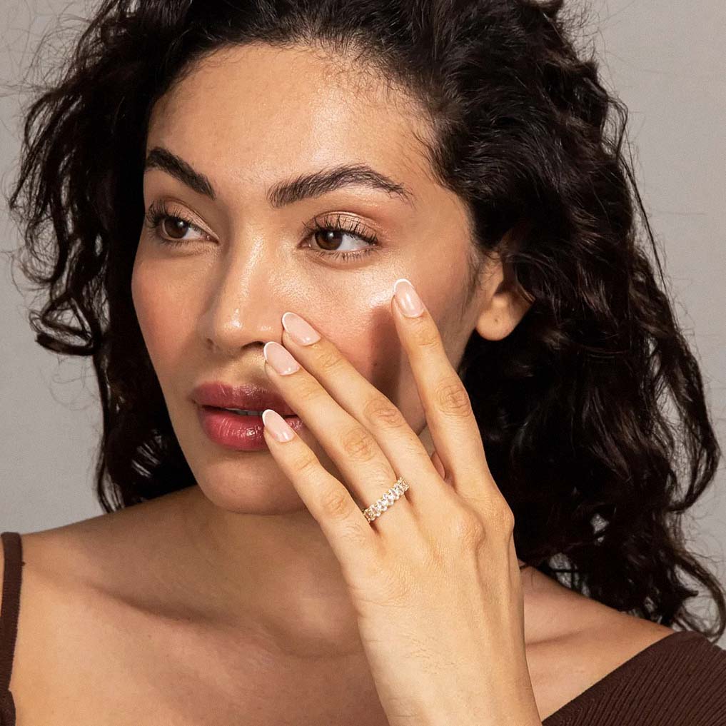 Model wearing gold-plated oval zirconia eternity ring for everyday style inspiration