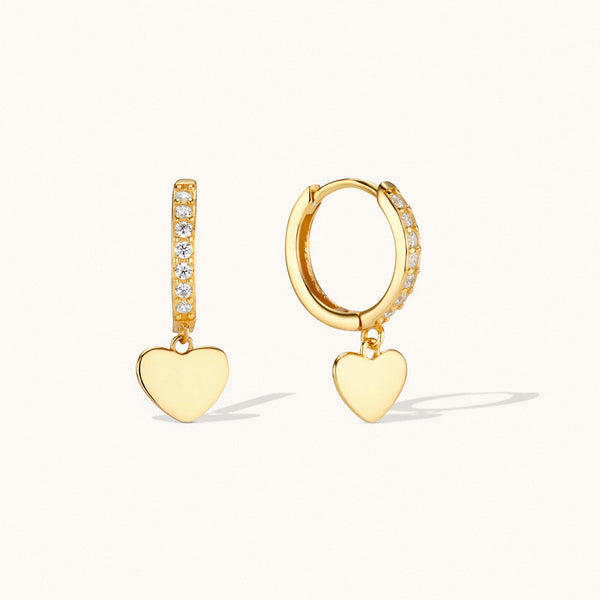Gold heart dangle huggie earrings with cubic zirconia detailing