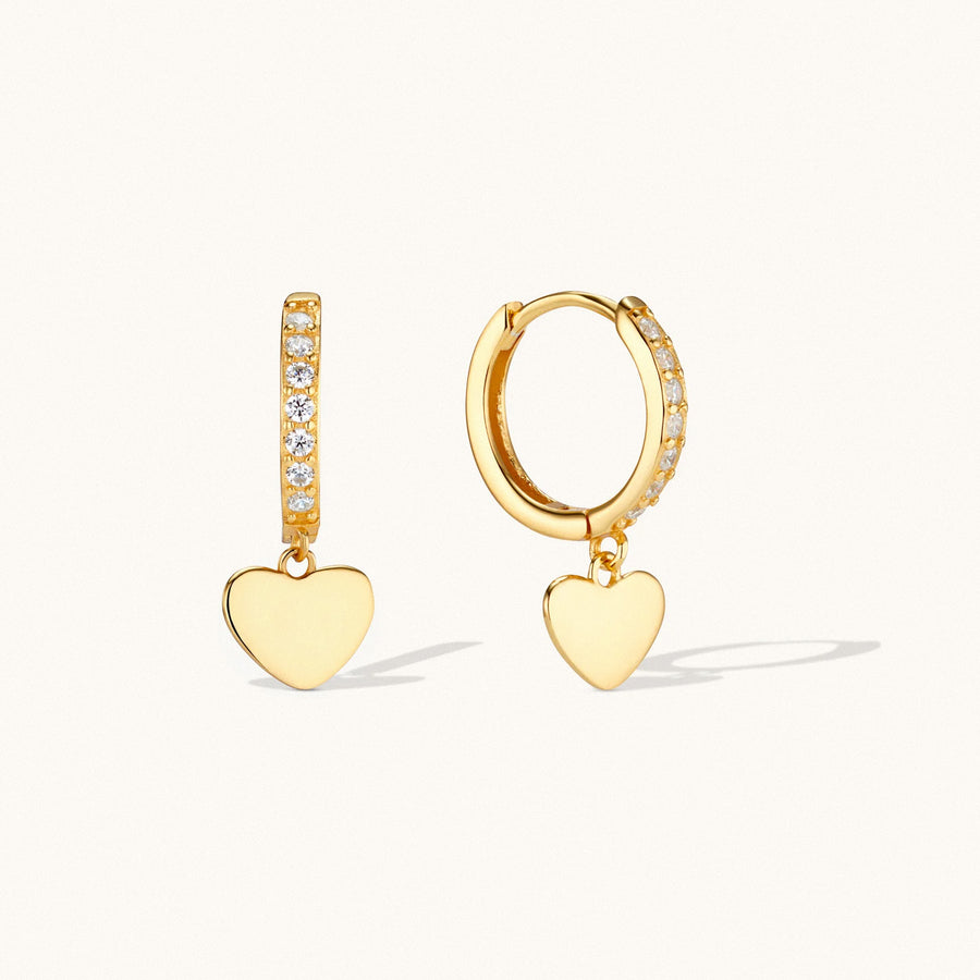 Gold heart dangle huggie earrings with cubic zirconia detailing