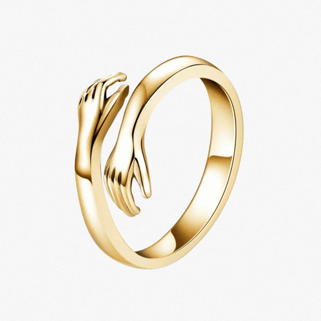 Gold hug ring with open band and hand-shaped ends