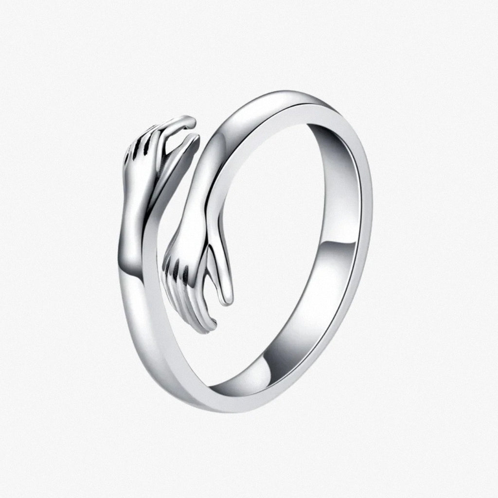 Silver hug ring with polished open-band hand design