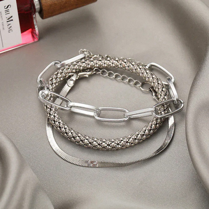 Silver layered bracelet set with mixed chain textures