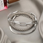 Silver layered bracelet set with mixed chain textures