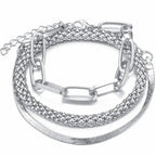 ilver mixed-chain bracelet stack featuring paperclip, rope and snake chains