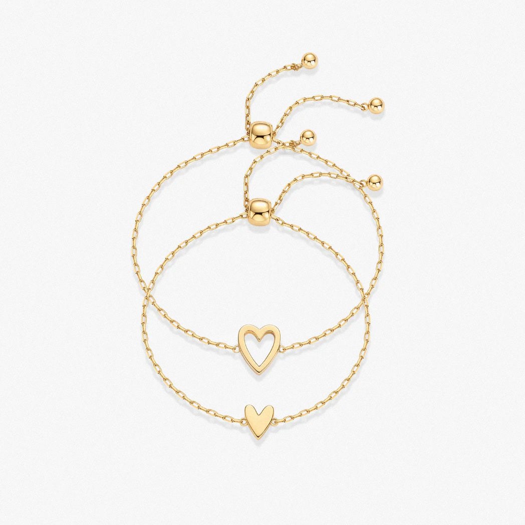Gold heart duo bracelet set featuring hollow and solid heart charms