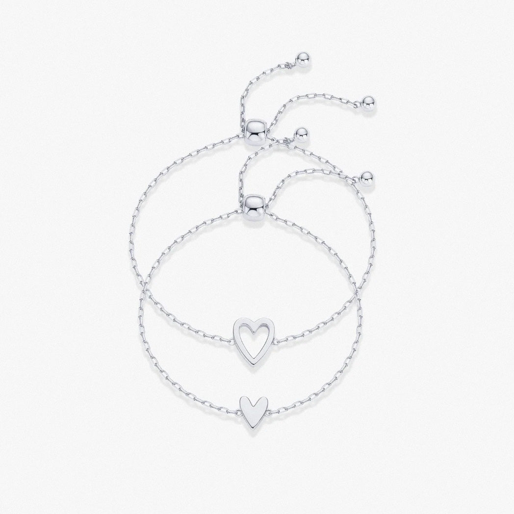 Silver adjustable heart duo bracelet set with hollow and solid heart charms
