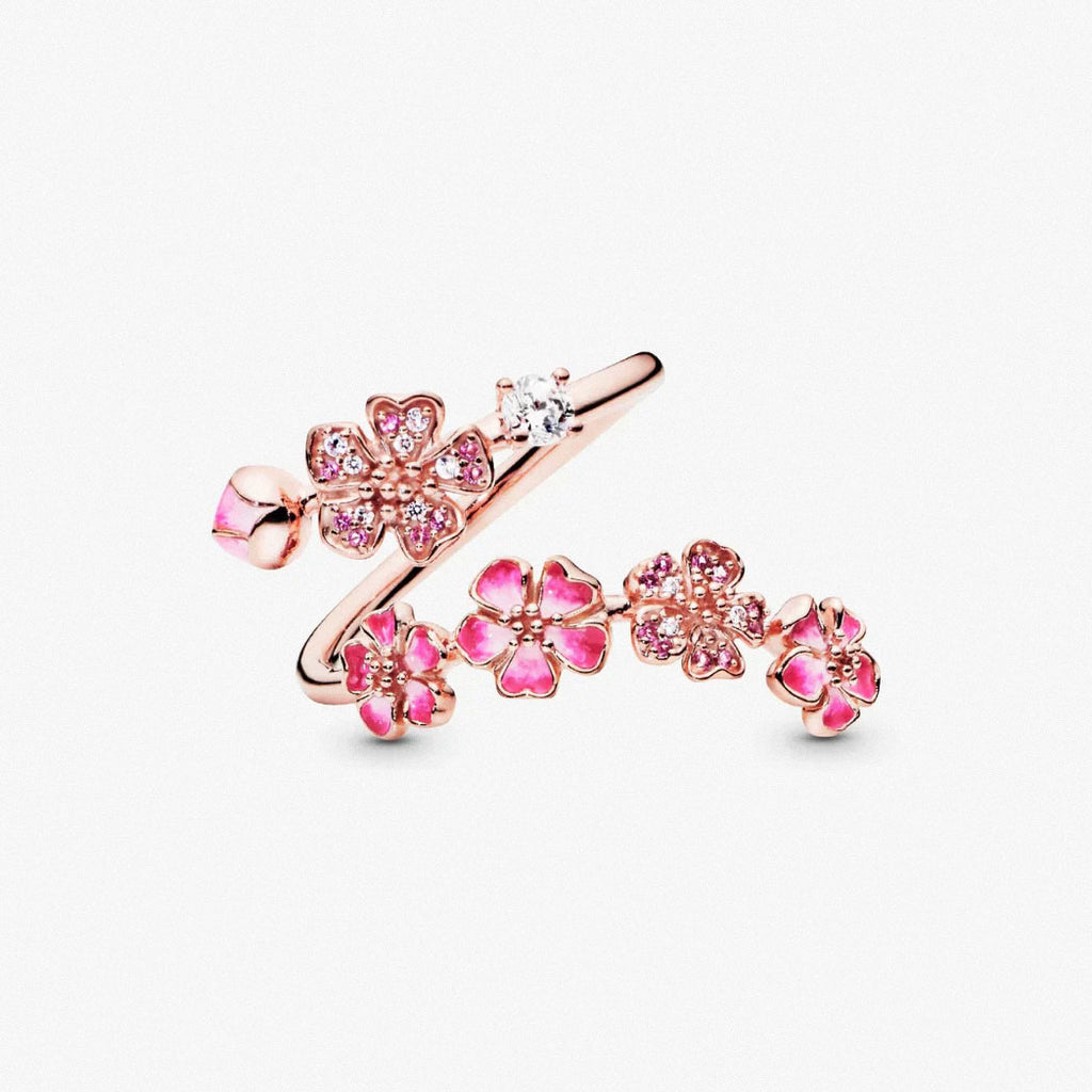 Pink peach blossom open ring in rose gold with floral accents on white background