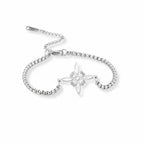 Sterling silver floral charm bracelet on wrist – minimalist cubic zirconia design