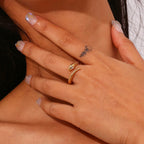 Gold snake ring with crystal accent shown on model’s hand